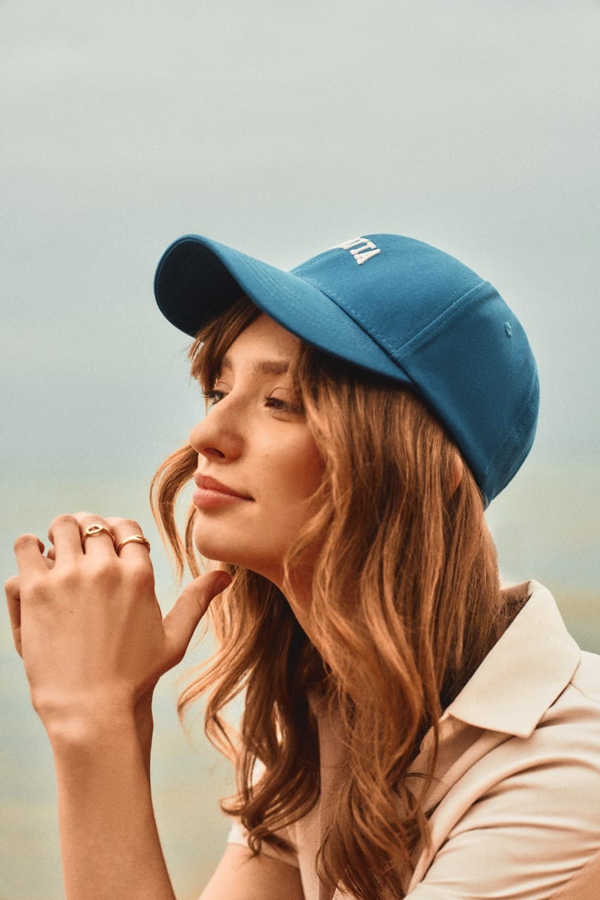 girl wearing a cap